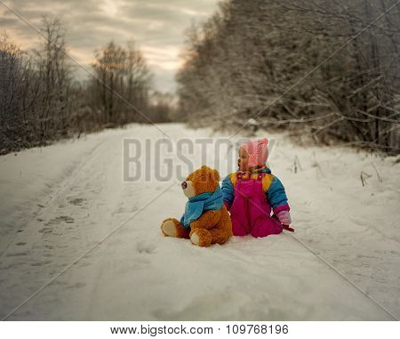 Little Girl And Teddy Bear Playing Outdoor