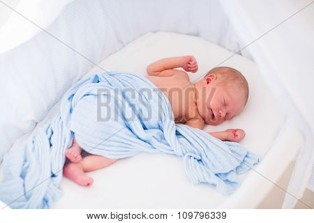 Cute Newborn Baby In White Bed