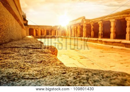 View of the Bala Krishna temple with dramatic bright sun Hampi Karnataka India.