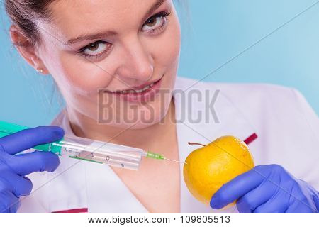 Scientist Doctor Injecting Apple. Gm Food.