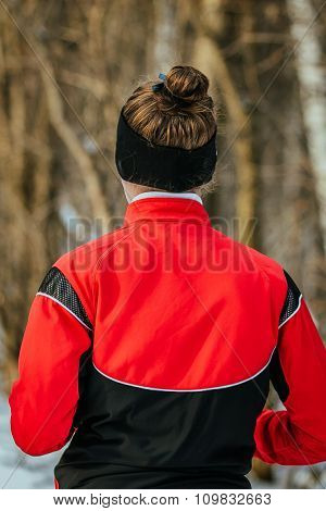 closeup girl running in winter forest