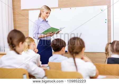 Teacher is busy reading out loud.