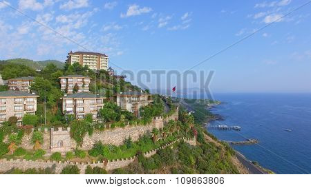 ALANIA - AUG 16, 2015: Hotel Utopia World on top of hill at summer day. Aerial view videoframe. Hotel Utopia World is a 5-star resort with total area of about 100000sq.m.