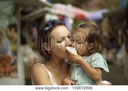 girl and mother eating ice cream
