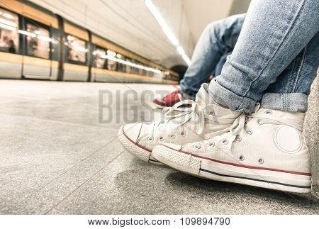 Young Girl Waiting For Train At Underground Station After Work - Urban And City Concept