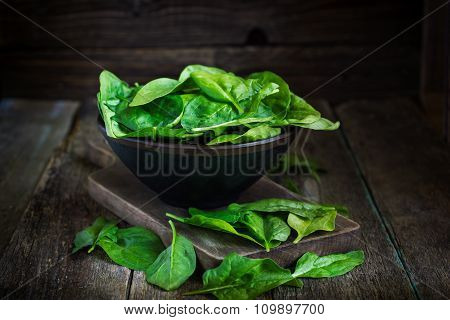 Fresh Spinach In Bowl On Wooden Background