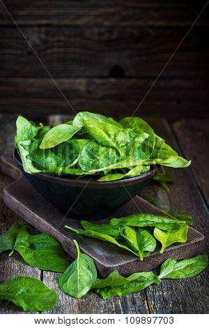 Fresh Spinach In Bowl On Wooden Background