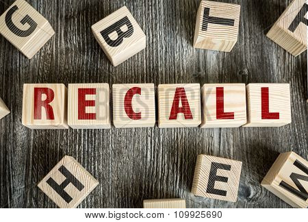 Wooden Blocks with the text: Recall