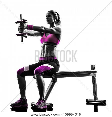 one caucasian woman exercising   weights body building fitness in studio silhouette isolated on white background