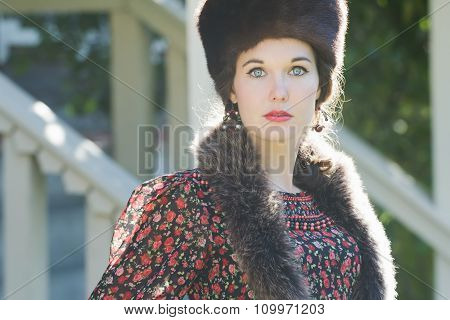 Head And Shoulders Portrait Of Russian Beautiful Woman Wearing Fur Cossack Hat And Fur Collar