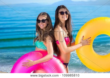 Girlfriends resting on the sea.