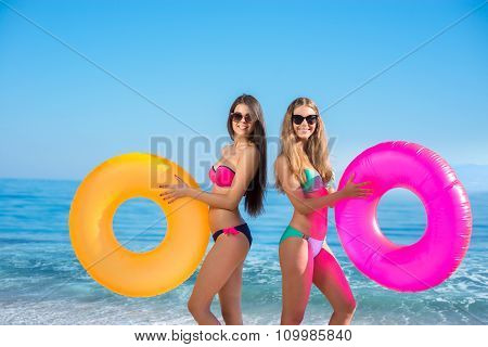 Girls with rubber rings at the resort.