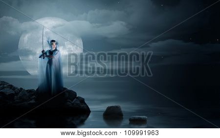 Elven girl on sea coast at night