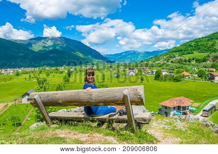 A Young Girl Dreams On A Wooden Bench Near The Sources Of Ali Pasha.