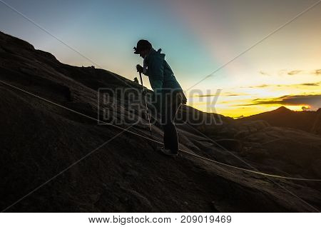 Mount Kinabalu,Ranau,Sabah.Malaysia-March 12,2016:Silhouette climber passing trail to the summit of Mountain Kinabalu during sunrise in Mount Kinabalu,Sabah,Malaysia.