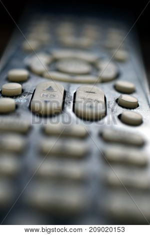 A close up low angle image of a TV remote control.