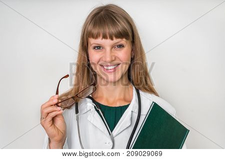 Portrait Of Successful Doctor With Stethoscope On White