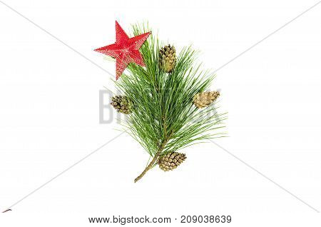 Fir tree branches with cones and decorative red toy star isolated on white background. Christmas pine tree branches decoration isolated.