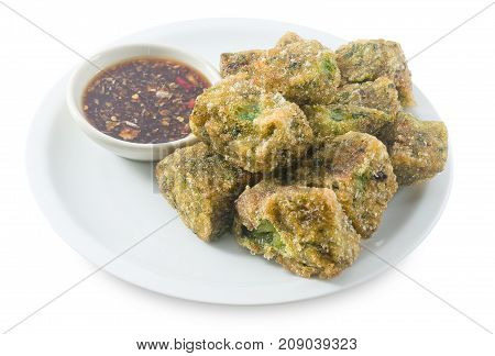 Plate of Fried Chinese Pancake or Fried Steamed Dumpling Made of Garlic Chives Rice Flour and Tapioca Flour Served with Spicy Soy Sauce. Traditional Food of China.