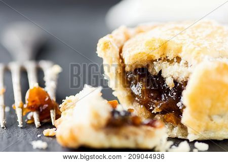 Traditional British Christmas Pastry Dessert Home Baked Mince Pie with Apple Raisins Nuts Filling. Open with Visible Texture. Golden Shortcrust Fork. Festive Table Setting