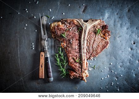 Fresh Tbone Steak And Chips With Salt And Rosemary