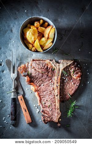 Tasty Tbone Steak And Chips With Salt And Rosemary
