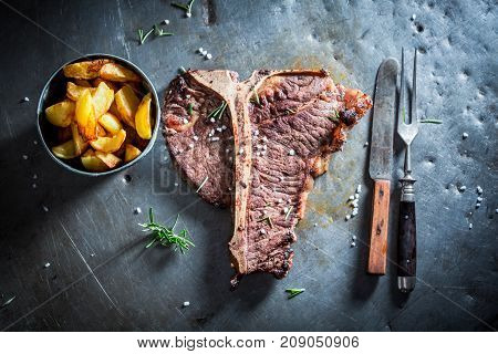 Tbone Steak And Chips With Salt And Rosemary