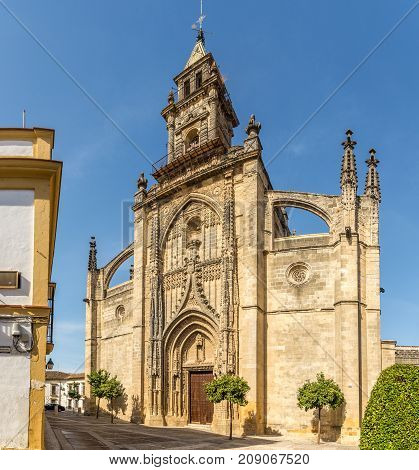 JEREZ DE LA FRONTERA,SPAIN - SEPTEMBER 30,2017 - View at facade of Santiago church in the streets of Jerez de la Frontera. Jerez is known as the city of flamenco sherry horses and motorcycles.