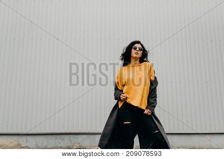 Portrait Of Stylish Modern Young Curly Woman In Coat Sunglasses. Crazy Style.