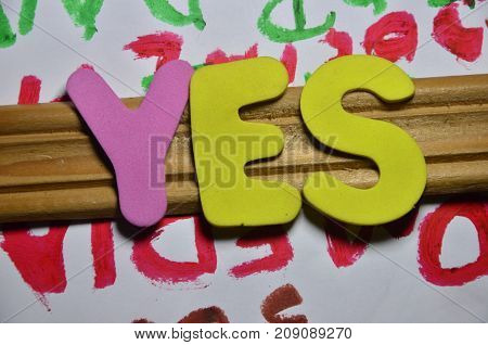 the word yes on a  abstract colorful background