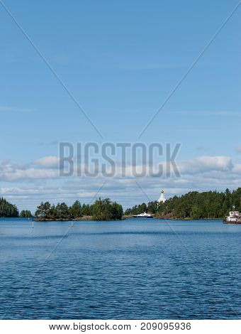 The panorama of the Bay on the island with ships and a Church far away on the island