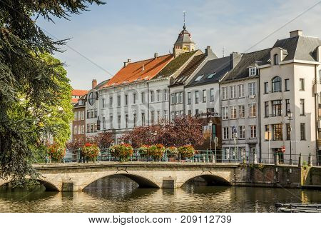 A view of the Belgian city, Lier and moored boats on the river Nete,