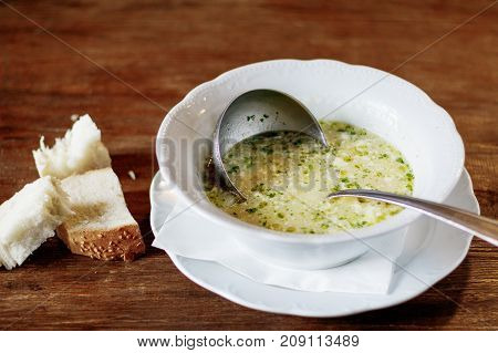 Bouillabaisse in Copper Pot on a wooden background