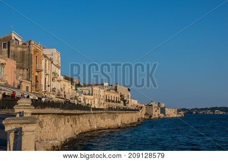 Syracuse, Italy - August 31, 2017: Sunset in Embankment of Ortygia island Syracuse city in Sicily.
