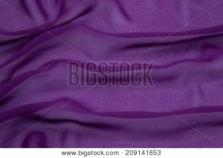 purple crumpled rayon on a white base with waves decomposed