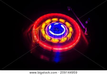 Turntable Playing Vinyl With Glowing Abstract Lines Concept On Dark Background. Selective Focus