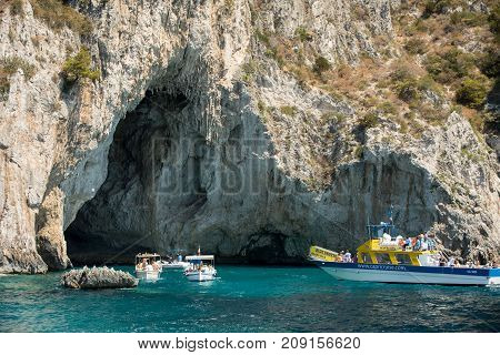 CAPRI ITALY - JUNE 13 2017: Boats with tourists near Grotta Bianca and Grotta Meravigliosa Capri iATLY