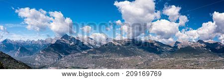Large panorama of swiss alps from Veysonnaz Alpine mountains with shadows of clouds