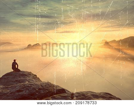 Tourist Sit On Peak Of Sandstone Rock And Watching Into Colorful Mist And Fog In  Morning Valley. Sa