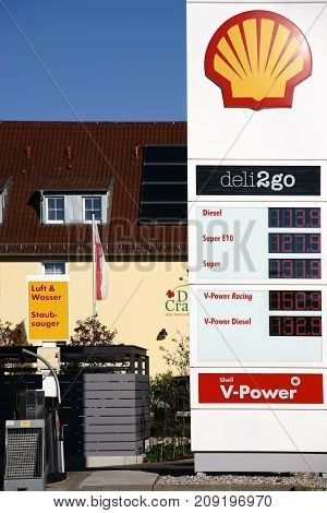 NIEDER-OLM, GERMANY - OCTOBER 14: The pre-column of a shell gas station with an air and water column next door on October 14 2017 in Nieder-Olm.