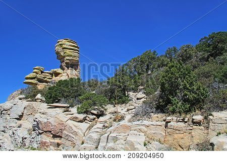 Hoodoo rock formation at Windy Point on Mount Lemmon in Tucson, Arizona, USA in the Santa Catalina Mountains located in the Coronado National Forest with blue sky copy space.