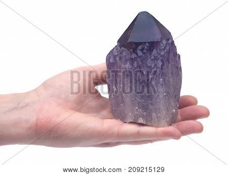Woman's hand holding Ametrine lightbrary point from Bolivia isolated on white background