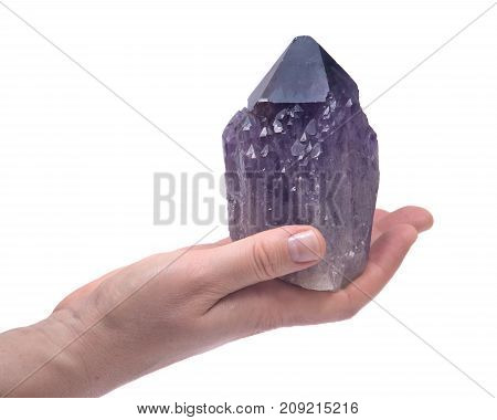 Woman's hand holding Ametrine lightbrary point from Bolivia isolated on white background