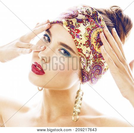 young pretty modern girl with bright shawl on head emotional posing isolated on white background, asian people ethnicity