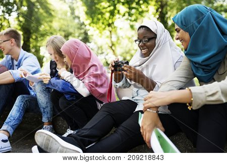 Group of students using mobile phone