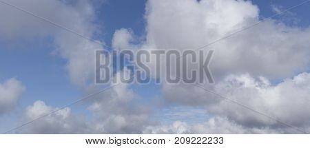 Sky background. Blue sky and white clouds.Celestial eye.  Natural background. Blue nature background.