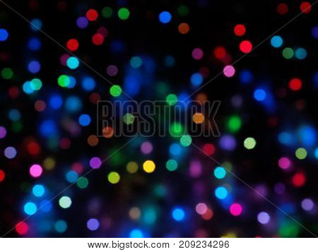 Holiday city lights bokeh or blur abstract. Color full of  focus holiday lights. Soft focus.