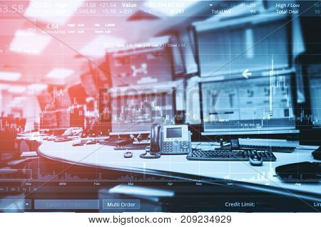 Double exposure of business stock trading room with computer and graph for Business Trading concept.