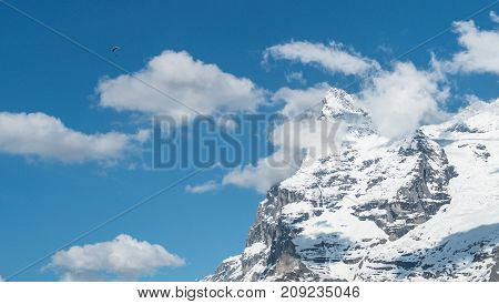 Switzerland - May 2017: Paragliding above the Alp mountains
