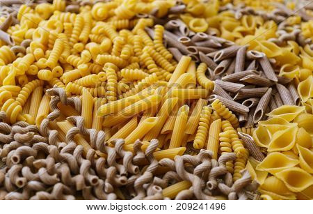 noodles pasta of different kinds scattered on the table.